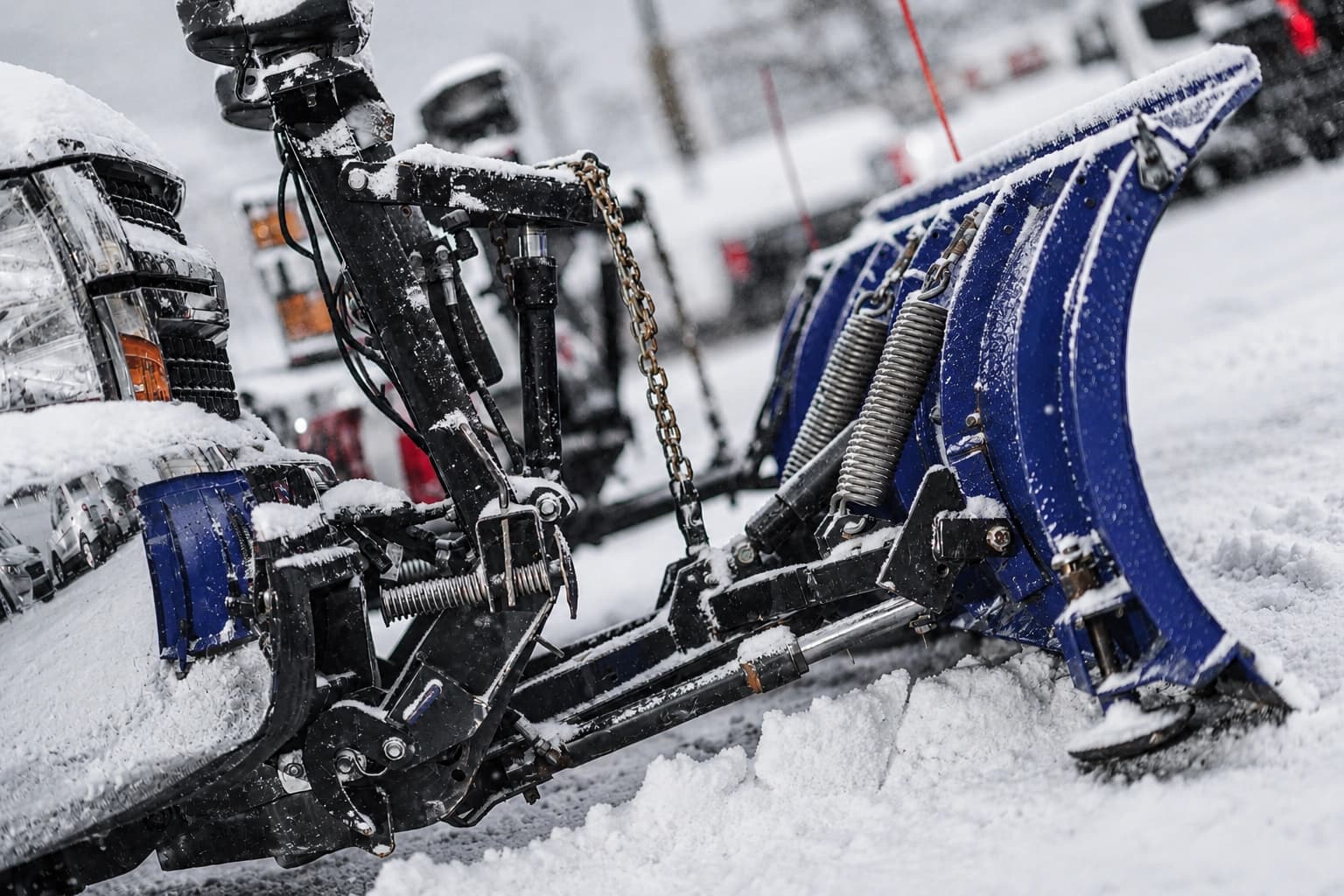 Commercial snowplow equipment clearing snow during a winter storm